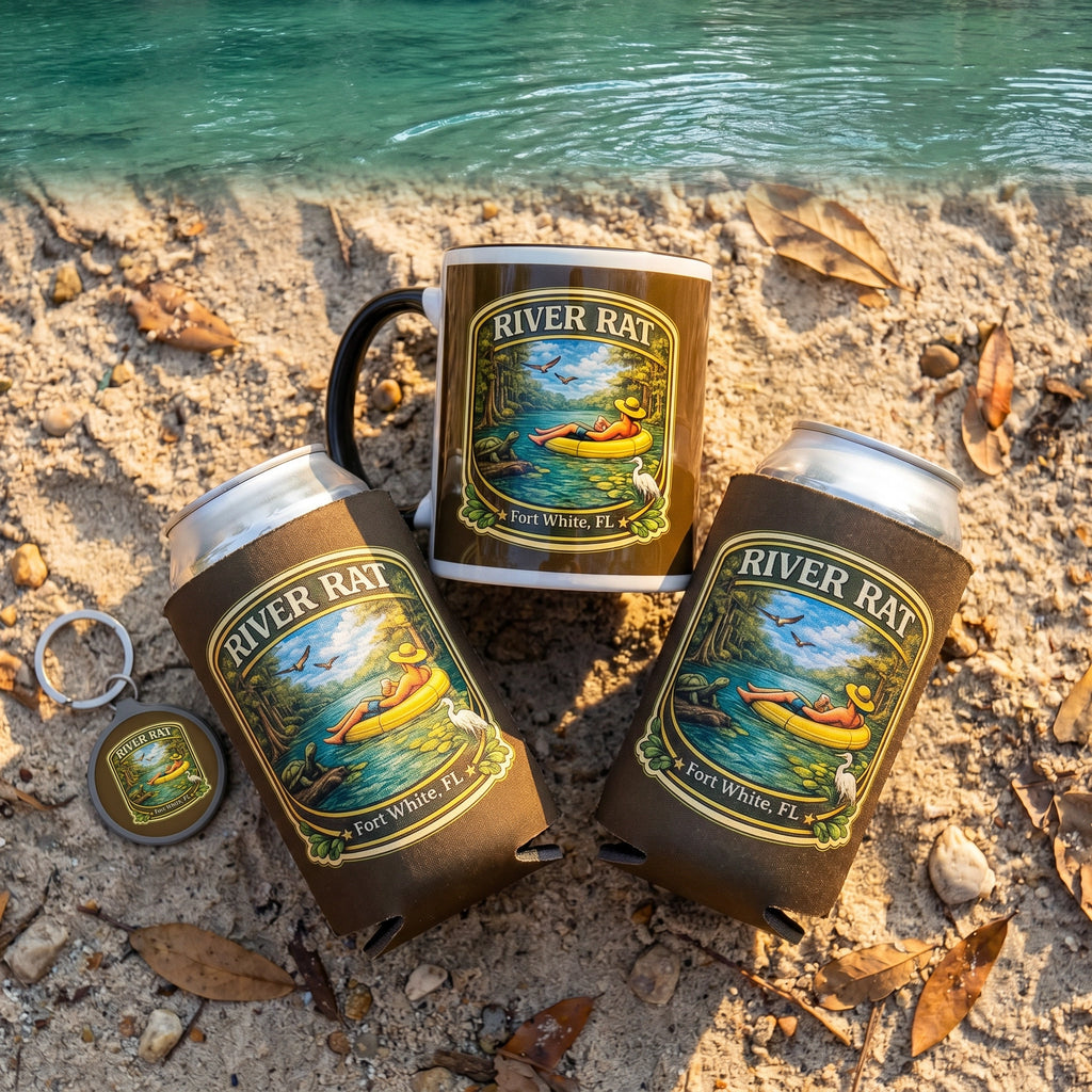 River Life Gift Bundle Mug Cozy Keyring flat-lay on sandy riverbank