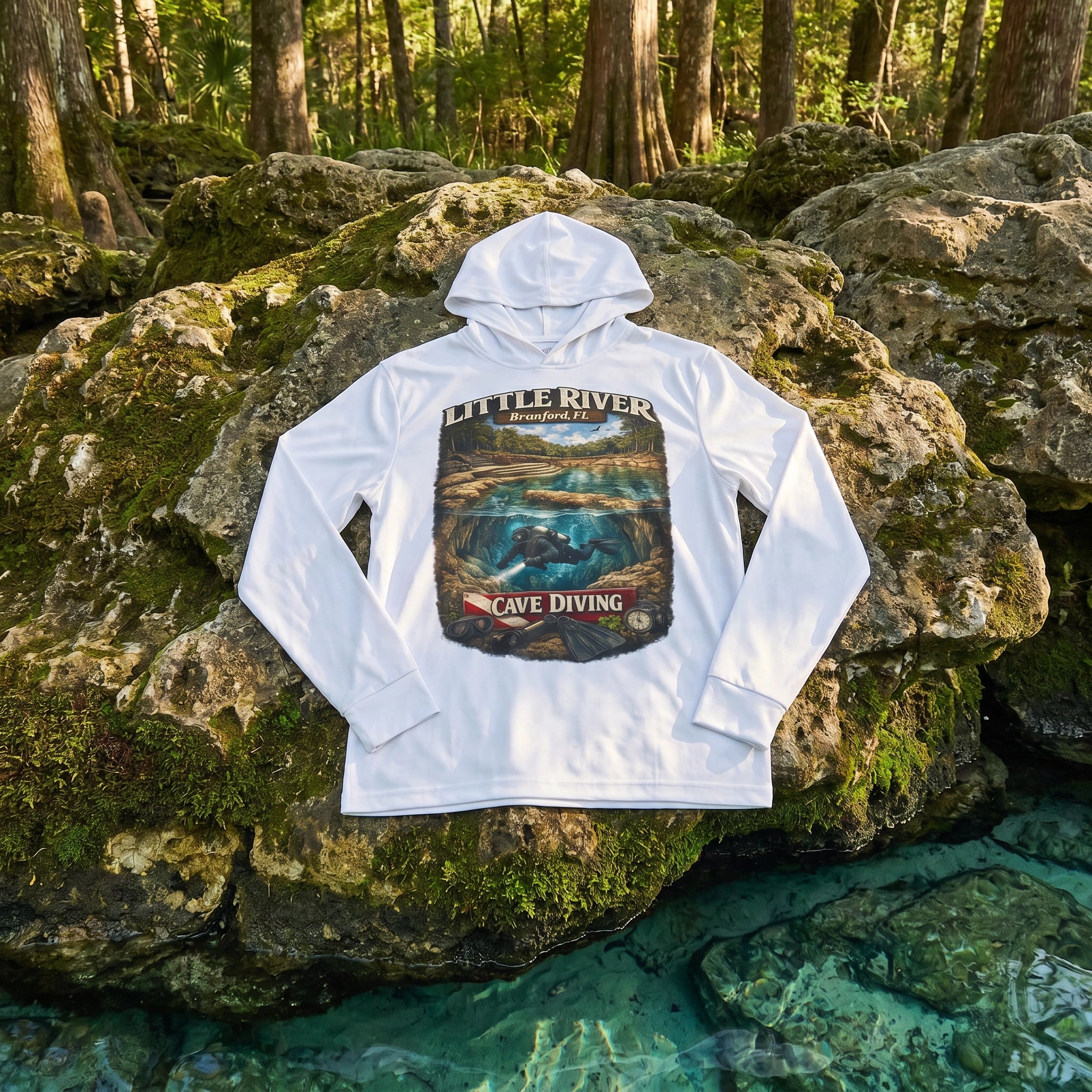 Little River Dive Performance Hoodie flat-lay on mossy limestone at spring