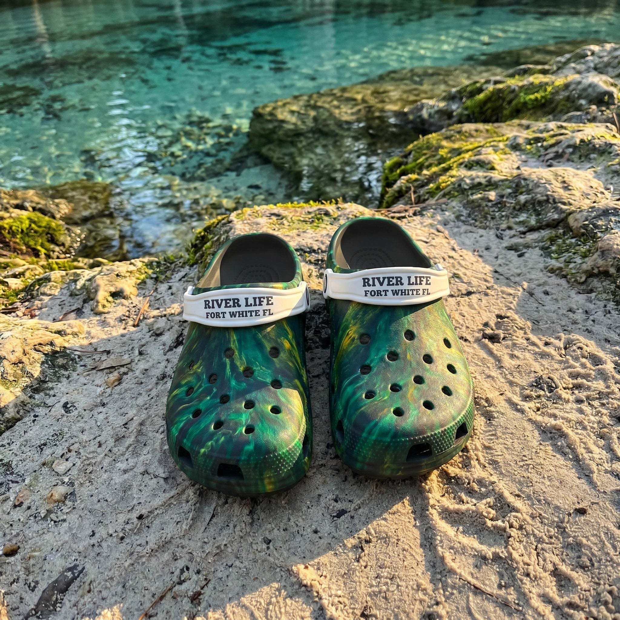 Golden Springs EVA Clogs flat-lay on sandy riverbank