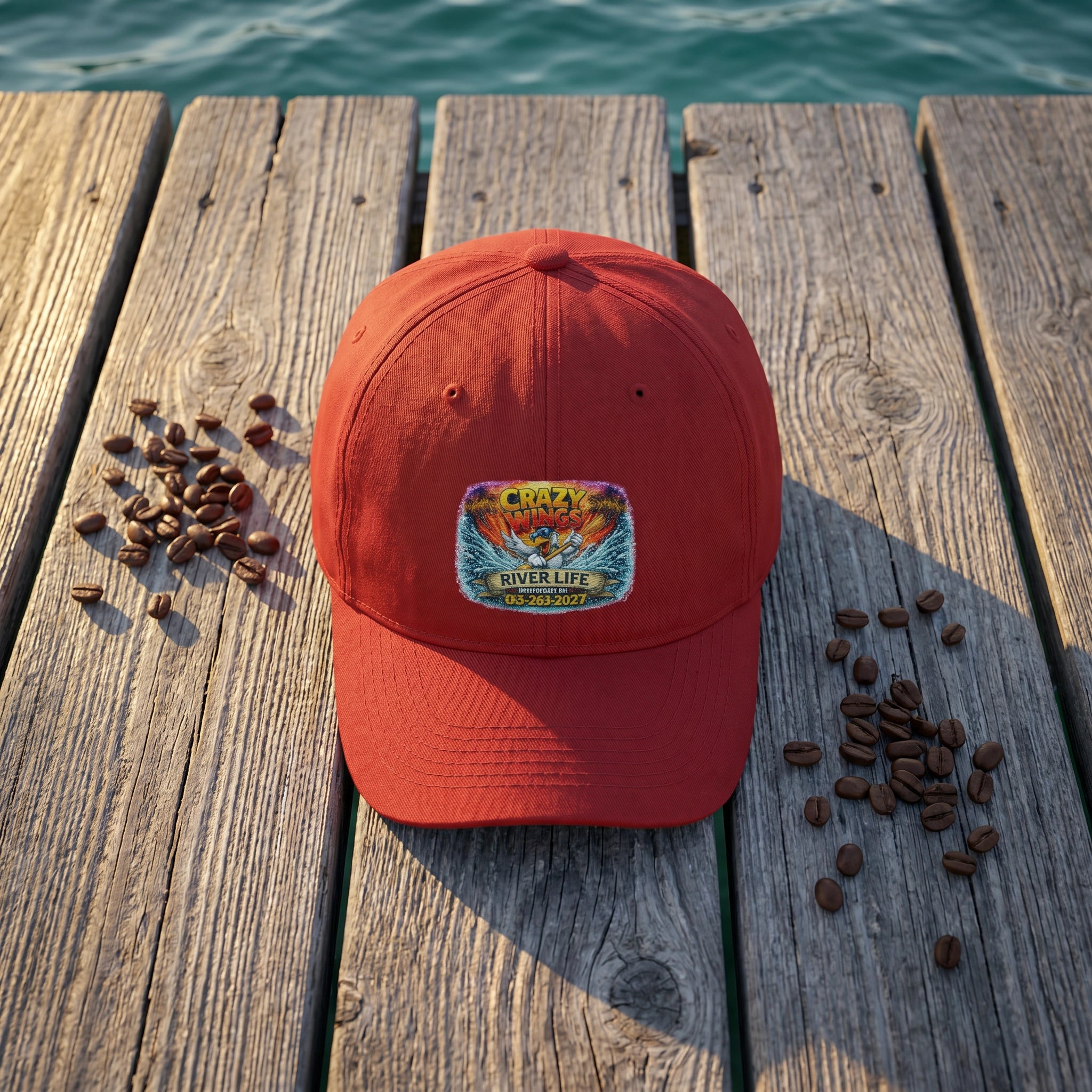 Crazy Wings River Life Dad Hat flat-lay on dock boards with spring water